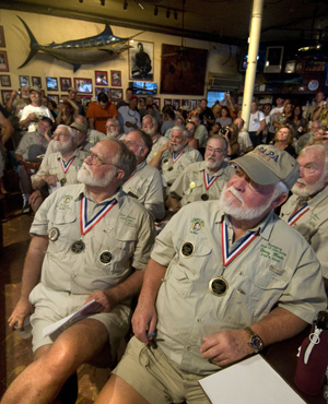 Previous winners of the "Papa" Hemingway Look-Alike Contest, including Fred Johnson, front left, and Denny Woods, front right, intently watch the 2010 finalists. 